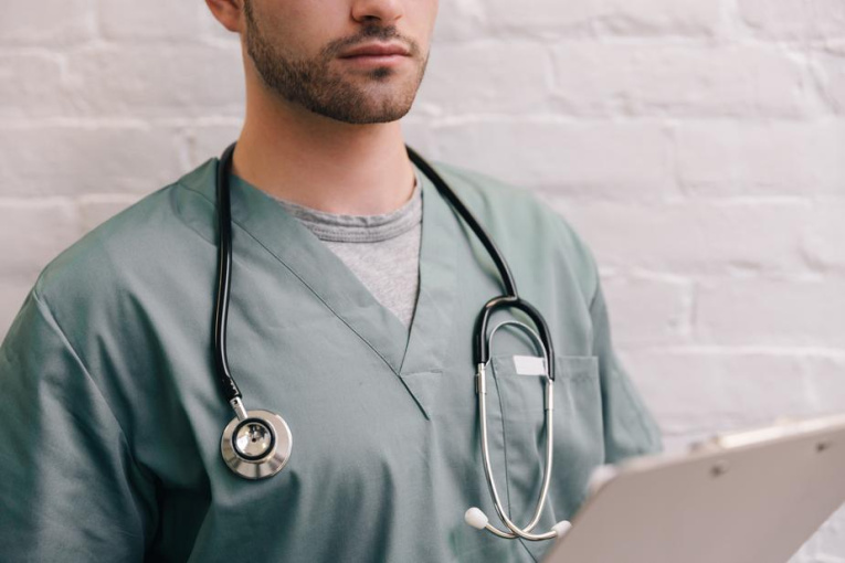 male-doctor-with-stethoscope-and-clipboard