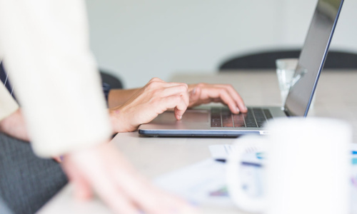 hands-using-computer-in-office