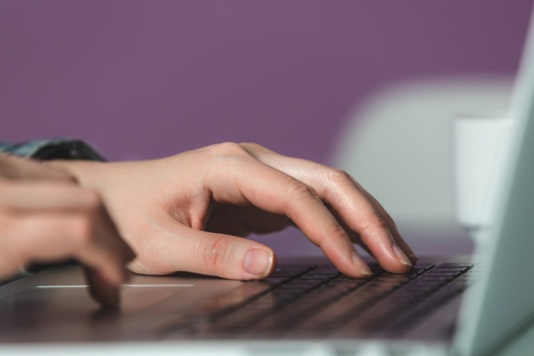 closeup-hands-on-laptop