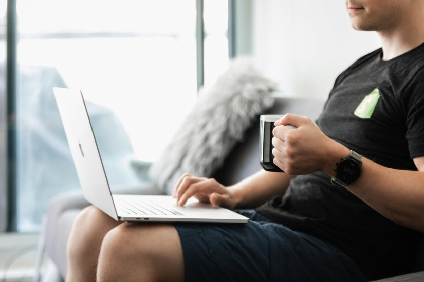 burst-matthew-henry-coffee-in-hands-working-on-the-couch