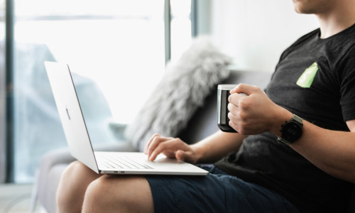 burst-matthew-henry-coffee-in-hands-working-on-the-couch